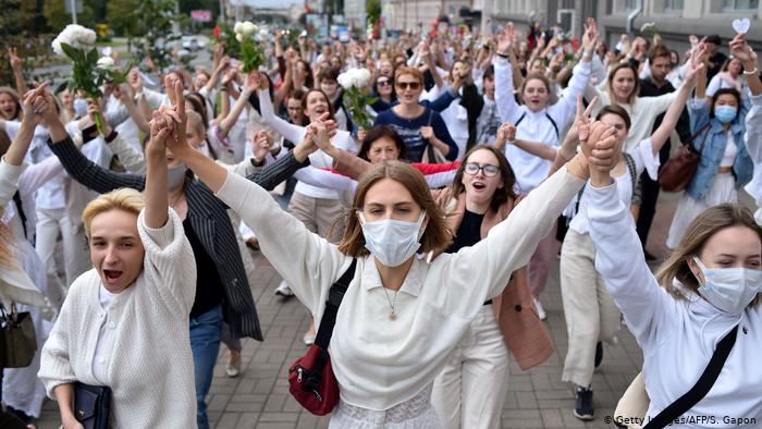 Women dressed in white protest against police brutality in Minsk