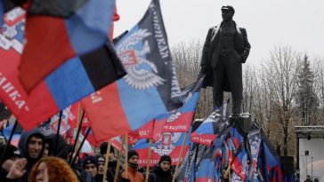 Flags of the so-called Donetsk People's Republic on display at a rally in Donetsk, Ukraine. REUTERS/Alexander Ermochenko