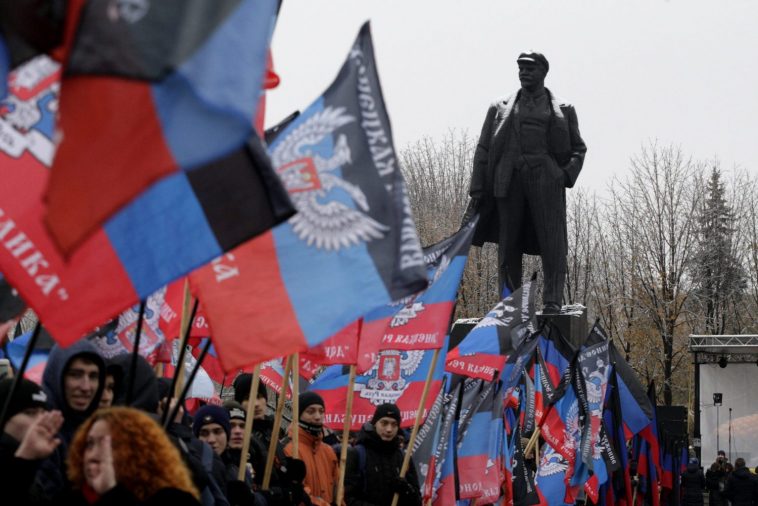 Flags of the so-called Donetsk People's Republic on display at a rally in Donetsk, Ukraine. REUTERS/Alexander Ermochenko